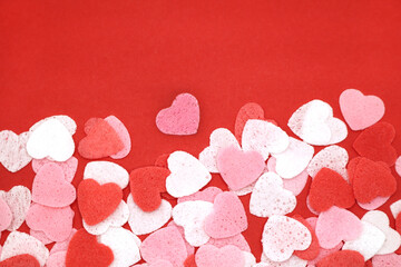 Red pink and white hearts on a red background. Valentine's day concept. Selective focus. Postcard. Background.