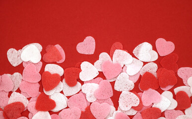 Red pink and white hearts on a red background. Valentine's day concept. Selective focus. Postcard. Background.