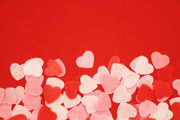 Red pink and white hearts on a red background. Valentine's day concept. Selective focus. Postcard. Background.