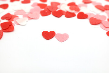 Red pink and white hearts on a white background. Valentine's day concept. Selective focus. Postcard. Background.