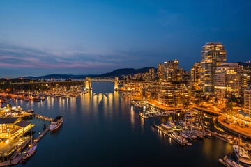 False Creek and Downtown Vancouver buildings at dusk, British Columbia, Canada.