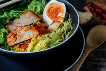 Red Pork Noodles with Boiled Egg in a Bowl Thai street food