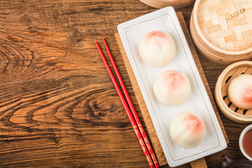 A peach-shaped birthday bun known as the Longevity Peach.Chinese specialty pastry，