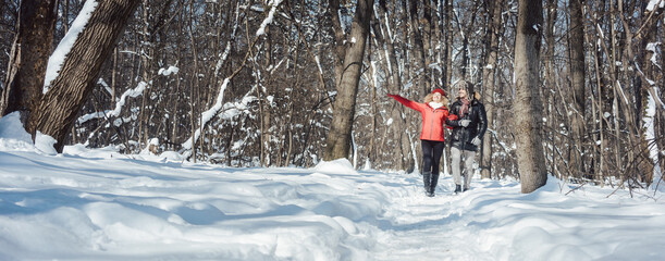 Woman and man having fun on a chilly winter day