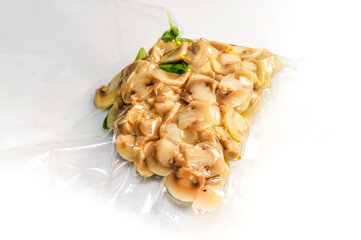 champignon mushrooms  vacuum packed sealed for sous vide cooking on white background