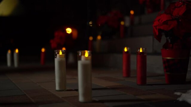 Beautiful Christmas holiday flower and candle arrangement on the sidewalk leading up to the Christ Church Cathedral Ottawa in Ontario Canada.