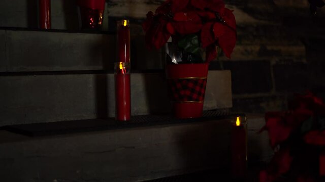 Beautiful Christmas holiday flower and candle arrangement on the exterior of the Christ Church Cathedral Ottawa in Ontario Canada.