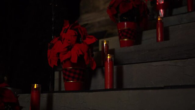 Beautiful Christmas holiday poinsettia and red candle arrangement on the exterior of the Christ Church Cathedral Ottawa in Ontario Canada.