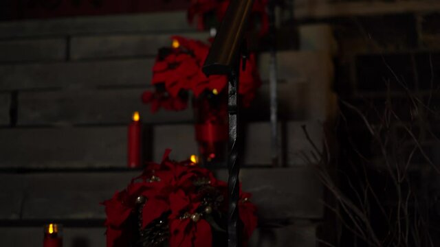 Beautiful Christmas holiday poinsettia and red candle arrangement on the exterior of the Christ Church Cathedral Ottawa in Ontario Canada.