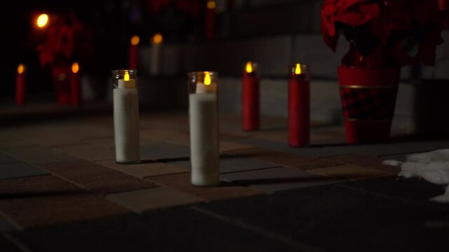 Beautiful Christmas holiday flower and candle arrangement on the sidewalk leading up to the Christ Church Cathedral Ottawa in Ontario Canada.
