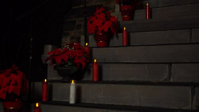Beautiful Christmas holiday poinsettia and red candle arrangement on the exterior of the Christ Church Cathedral Ottawa in Ontario Canada.
