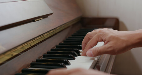 Fototapeta premium Man play piano at home