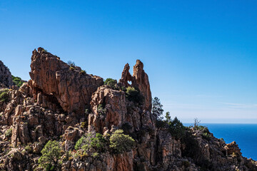 Heart shaped hole in a rock formation in the bizzare landscape of Calanche de Piana, located in n the Gulf of Porto, on the west coast of Corsica, France