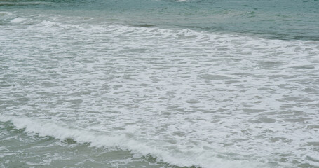 Sea wave splash over the beach