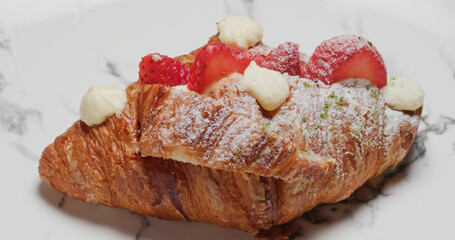 Homemade Croissant with strawberry and cream