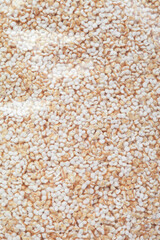 Old wooden table with a portion of puffed Amaranth as detailed close-up shot (selective focus)