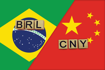 Brazil and China currencies codes on national flags background