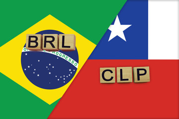 Brazil and Chile currencies codes on national flags background