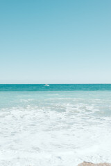 Fototapeta na wymiar vertical empty turquoise mediterranean beach 