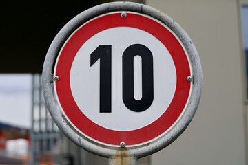 Traffic sign speed limit 10 kilometers per hour.
