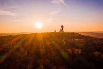 sunset above silhouette of former surveillance station in berlin
