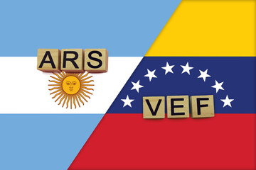 Argentina and Venezuela currencies codes on national flags background
