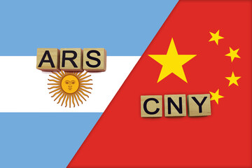 Argentina and China currencies codes on national flags background