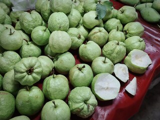 Pile of Fresh Green Guava Fruits for Sale at Market Stall