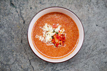 Sukiyaki dip sauce with chopped garlic and chopped red chilli