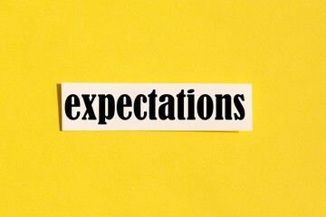 The word expectations on a yellow background. concept.the concept of expectations