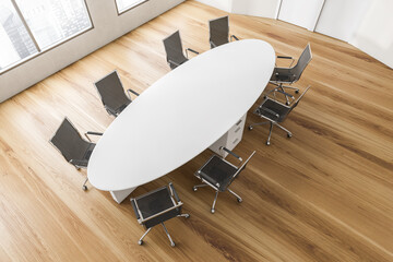 Fototapeta na wymiar Top view of white and wooden conference room with modern furniture