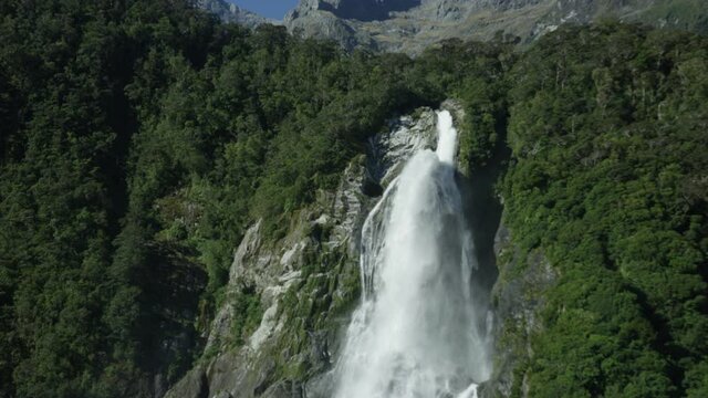 Epic slow motion shot of waterfall in Milford sound