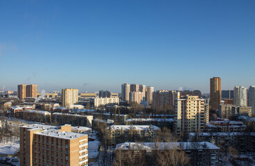 top panoramic view of the city with modern high residential buildings on a frosty winter sunny day against a clear blue sky and space to copy in Reutov Moscow Region Russia