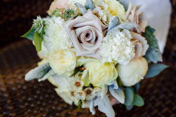 Wedding bouquet with white roses and dew.