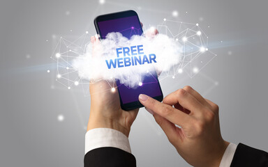 Female hand touching smartphone with FREE WEBINAR inscription, cloud business concept