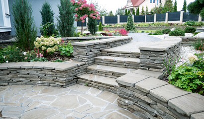 modern landscape design, outdoor stairs with coating of flat stones