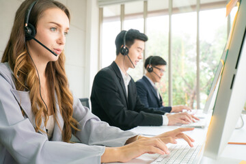 Business men and women operator business group working on the line with computer