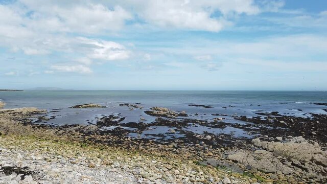 Endless view from coastline of Howth near Dublin - Pan from left to right