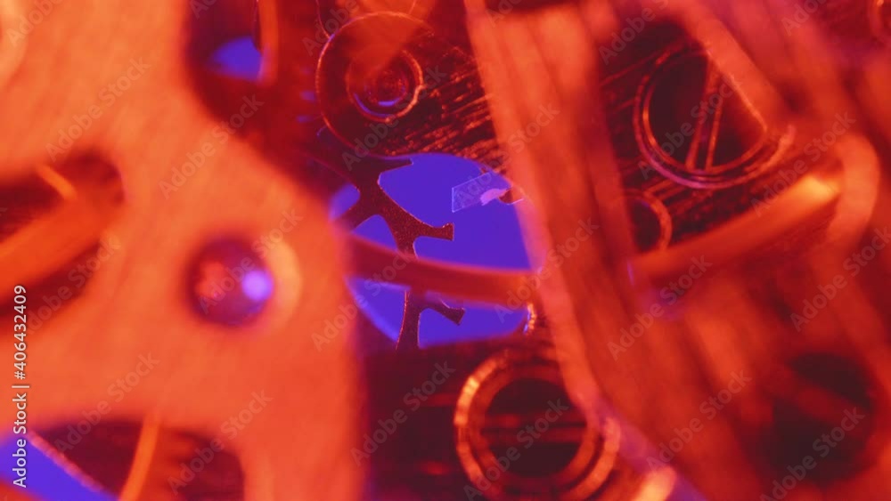 Poster macro shot of vintage clock mechanism in red light.