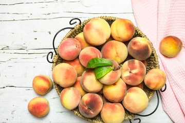 Ripe juicy peaches on a rustic background