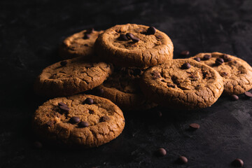 Chocolate chip cookies on a black table