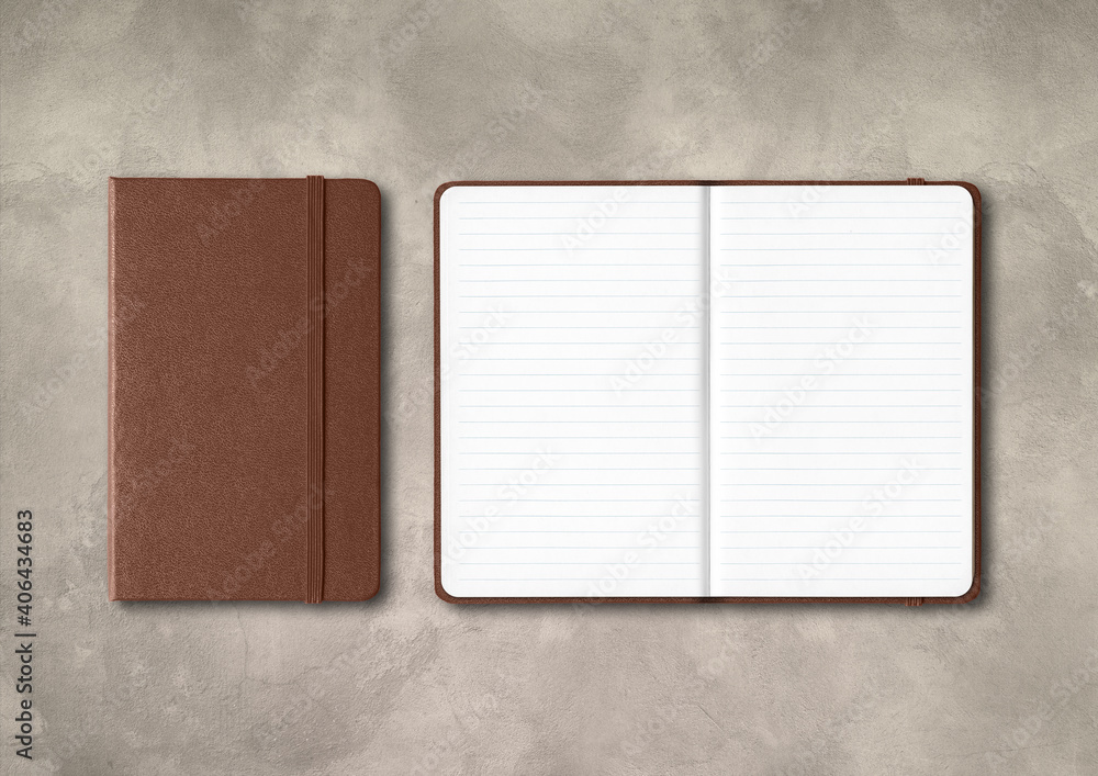 Canvas Prints Dark leather closed and open lined notebooks on concrete background