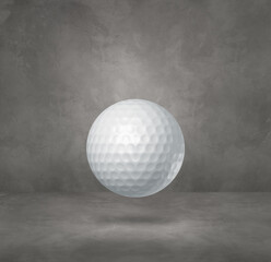 White golf ball on a concrete studio background
