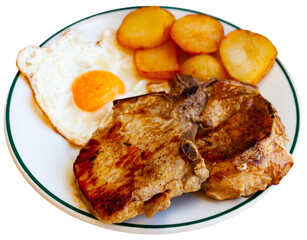 Appetizing pork chop with potatoes and scrambled eggs. Isolated over white background