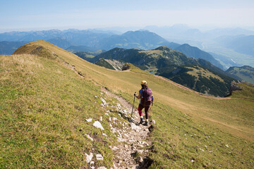Fototapeta premium hiking young woman at the mountain ridge trail, Rofan mountains austria