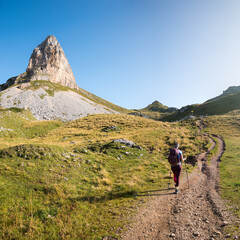 young woman at the mountain trail, Rofan mountains austria. square format.