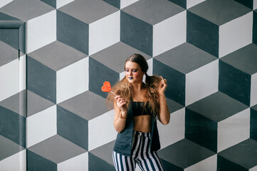 Young clown girl posing with sweet