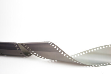 Old vintage film for a camera on a white background.