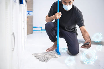 Asian man inspection cleaning staff in kitchen, bathroom blurry background Metaphor for cleaning Get rid of germs In bathroom, home office.For reliability And satisfaction of service and customers.