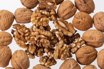 Peeled walnuts and its kernels. Isolated on a white background 